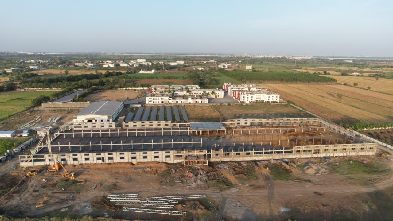 Wide aerial view of industrial infrastructure construction